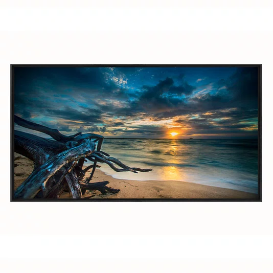 Quadro Paisagem de Praia ao Pôr do Sol com Tronco na Areia e Reflexo no Mar