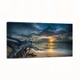 Quadro Paisagem de Praia ao Pôr do Sol com Tronco na Areia e Reflexo no Mar